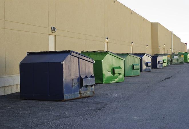 red and green waste bins at a building project in Farmington